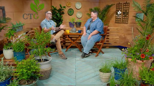 man and woman on CTG studio set with plants