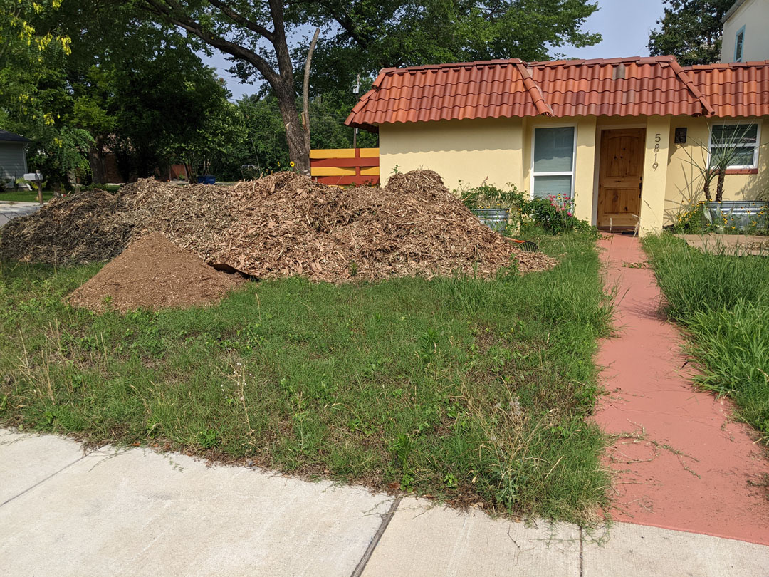 big pile of mulch in front yard