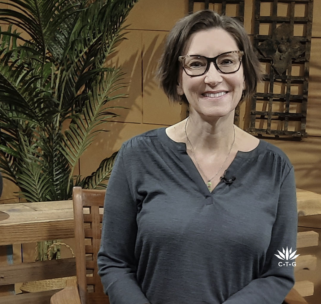 smiling woman on TV set