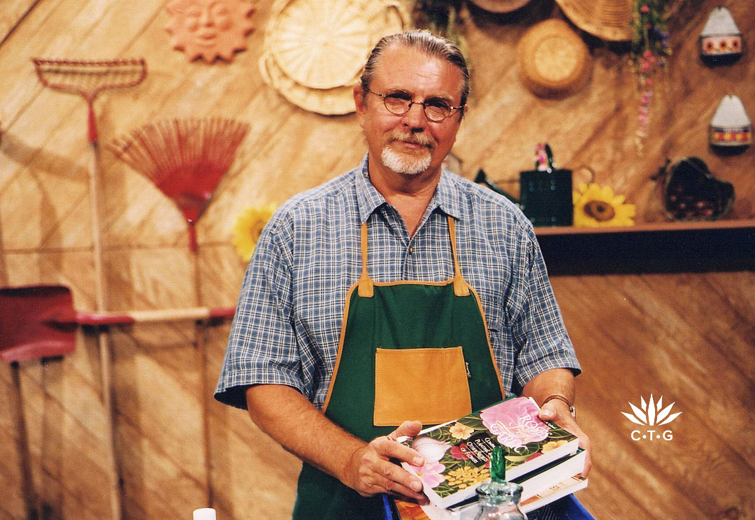 man in garden apron on TV set 