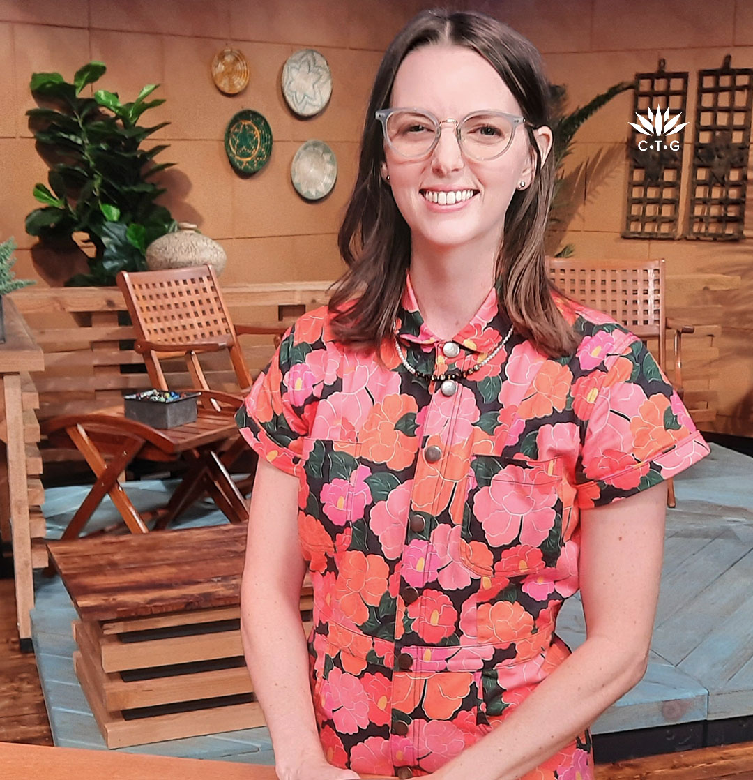 smiling woman on TV set