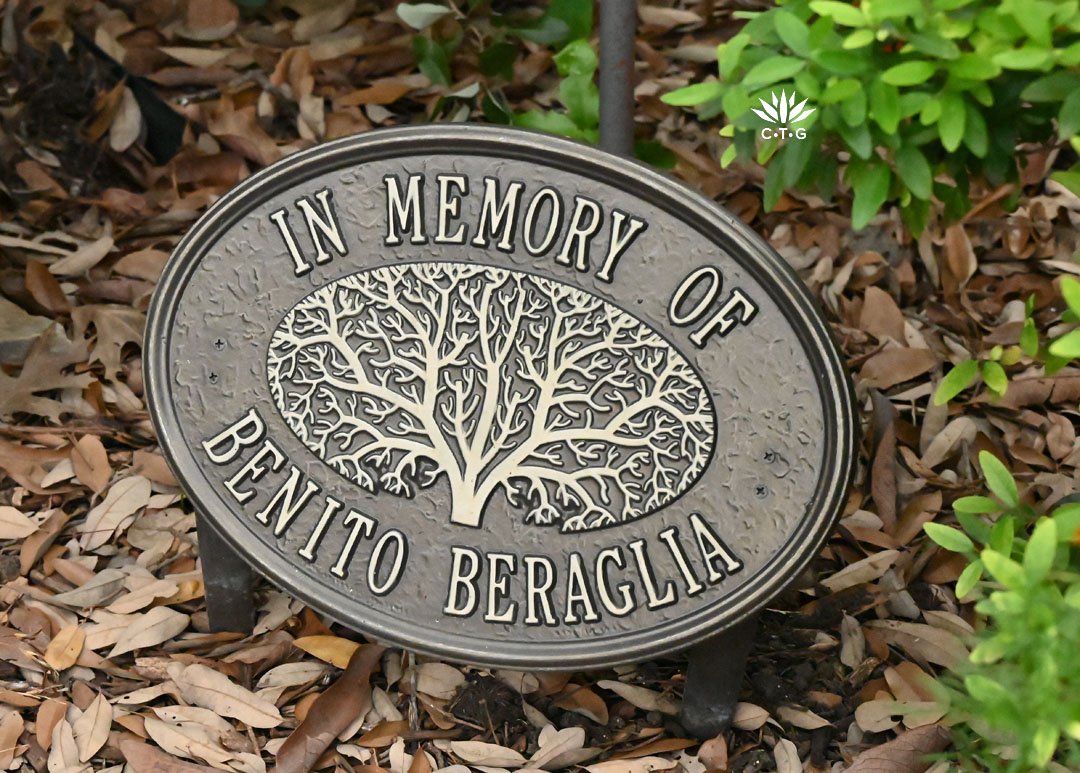 bronze metal plaque inscribed "In Memory of Benito Beraglia" 