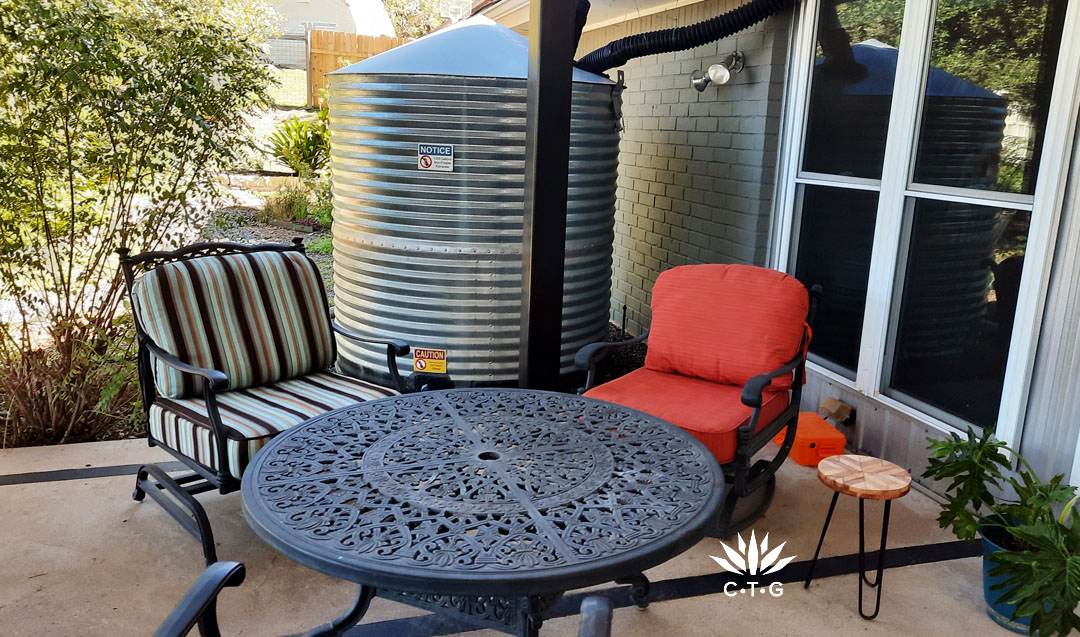 metal rainwater tank against patio 