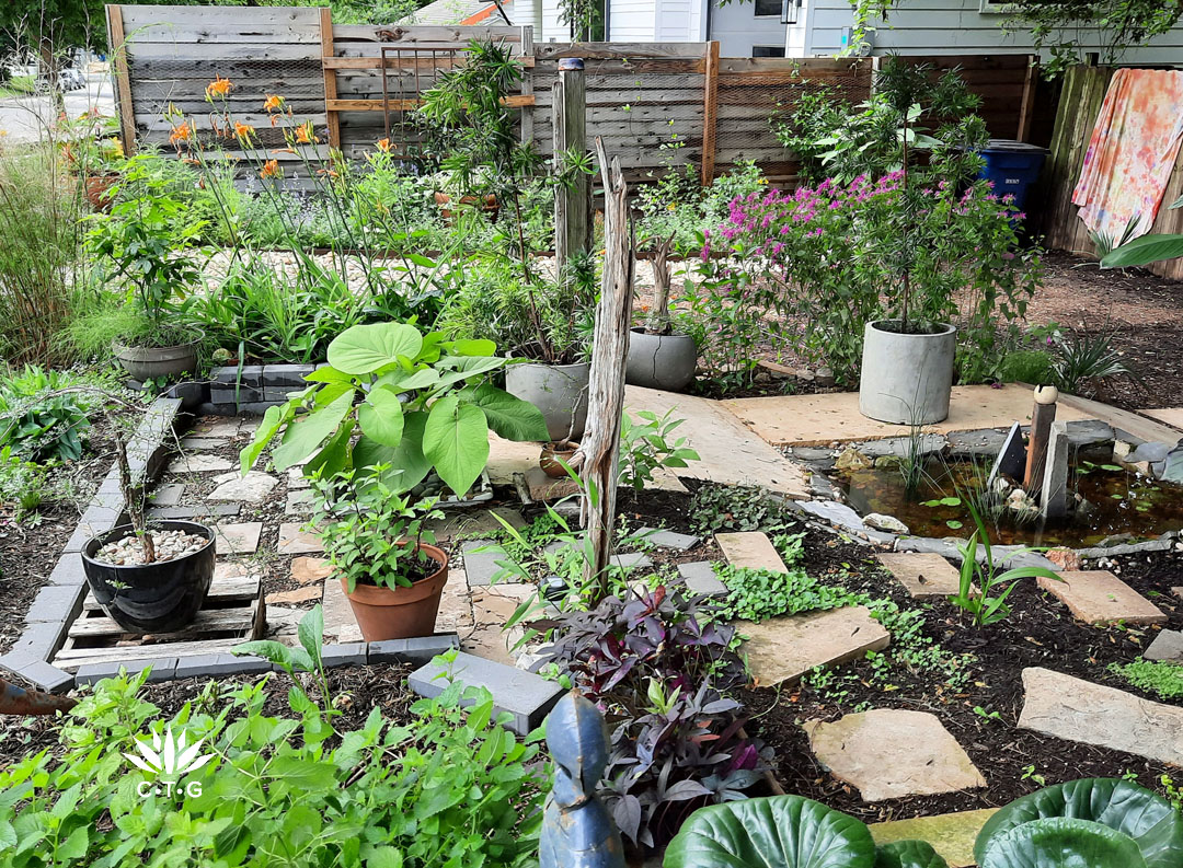 tiers of pavers and plants in small front yard