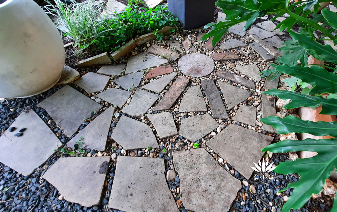 starburst pattern with pavers of different sizes and shapes