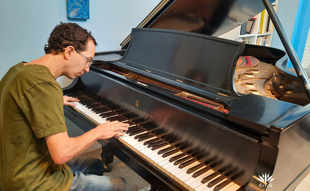 young man playing piano